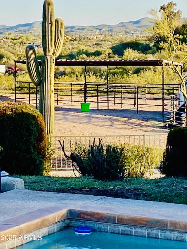 surrounding community with a mountain view and a rural view