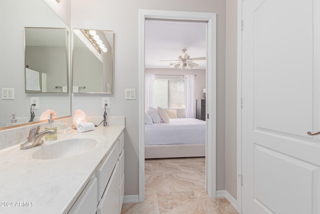 bathroom featuring ceiling fan and vanity