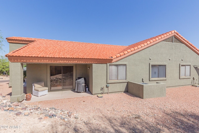 rear view of property with a patio area