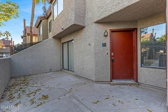 doorway to property featuring a patio