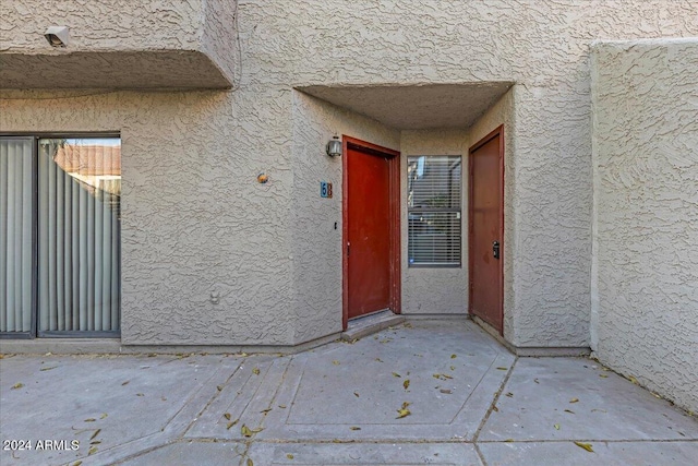 doorway to property featuring a patio area