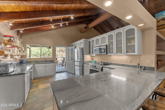 kitchen featuring wood ceiling, appliances with stainless steel finishes, kitchen peninsula, and white cabinets