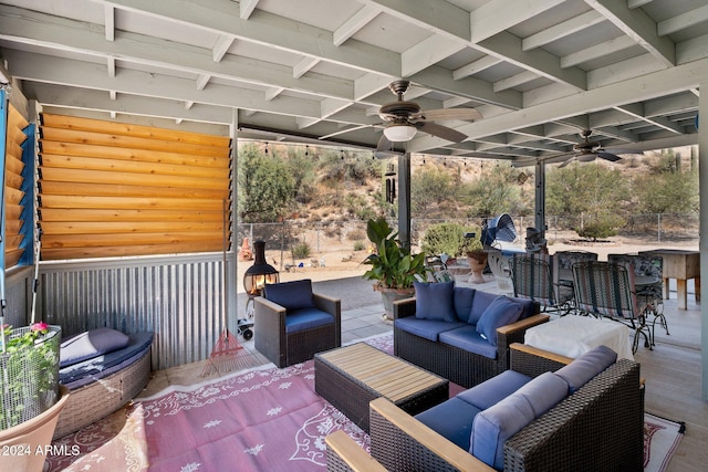 view of patio / terrace with ceiling fan, a bar, and outdoor lounge area