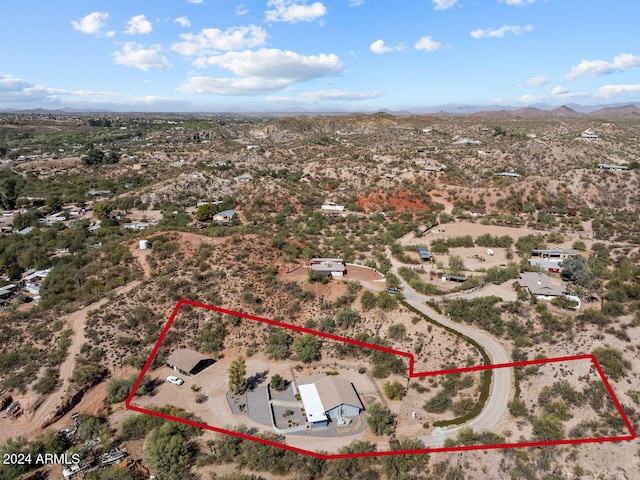 birds eye view of property featuring a mountain view