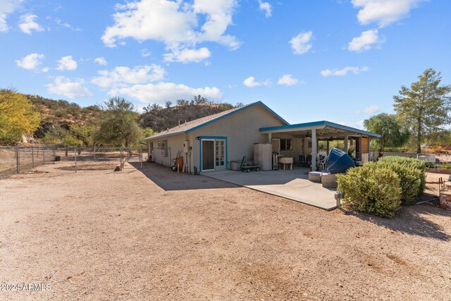 rear view of house with a patio area