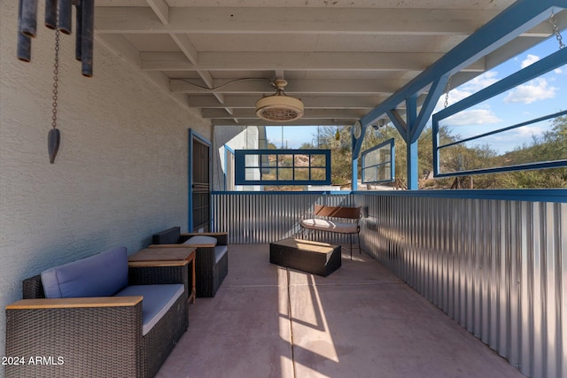 view of patio / terrace with a lanai and ceiling fan