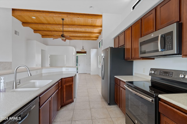 kitchen featuring appliances with stainless steel finishes, sink, beamed ceiling, ceiling fan, and light tile patterned flooring