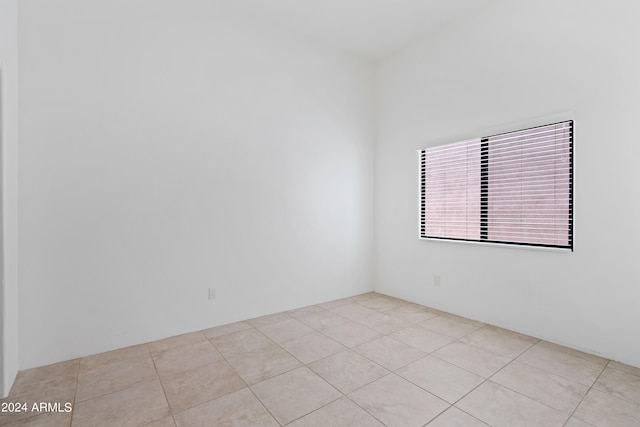 empty room with light tile patterned floors