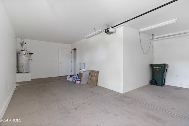 garage featuring gas water heater and a garage door opener