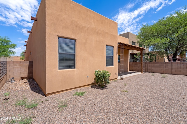 back of house featuring a patio