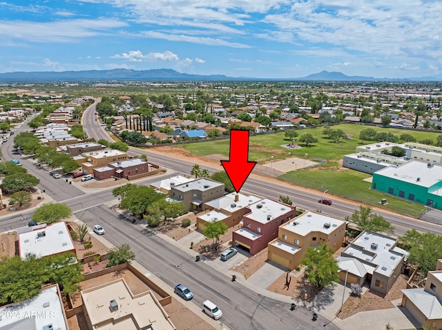 birds eye view of property with a mountain view