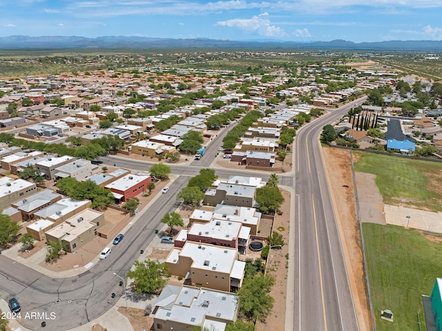 birds eye view of property with a mountain view