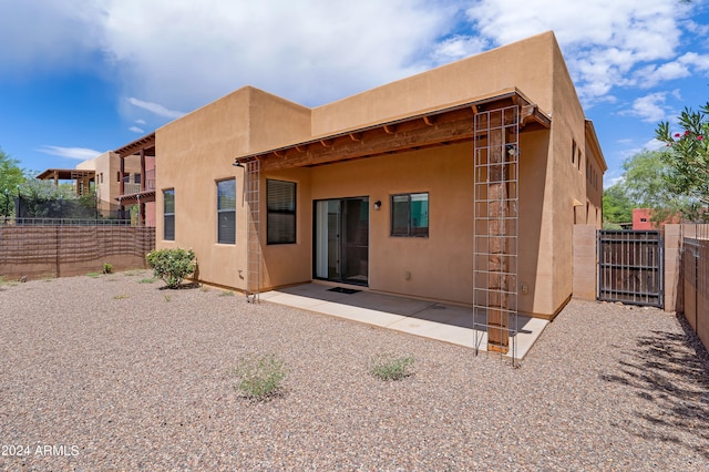 back of house with a patio area