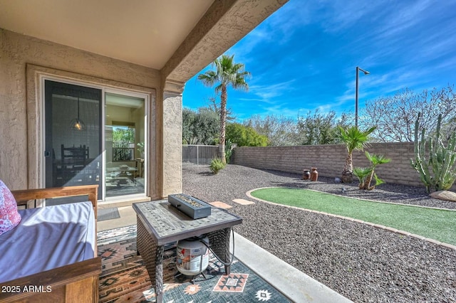 view of patio featuring a fenced backyard