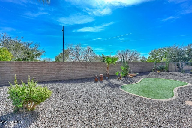 view of yard with a fenced backyard