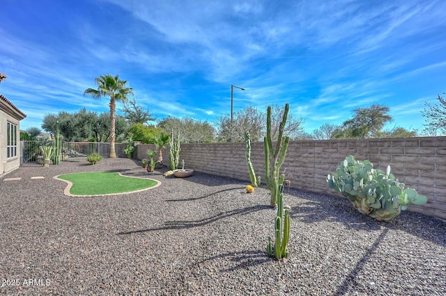 view of yard featuring a fenced backyard