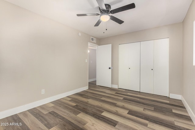 17228 N 16th Dr Unit 3, Phoenix, AZ 85023 - unfurnished bedroom featuring wood finished floors, a closet, and ceiling fan