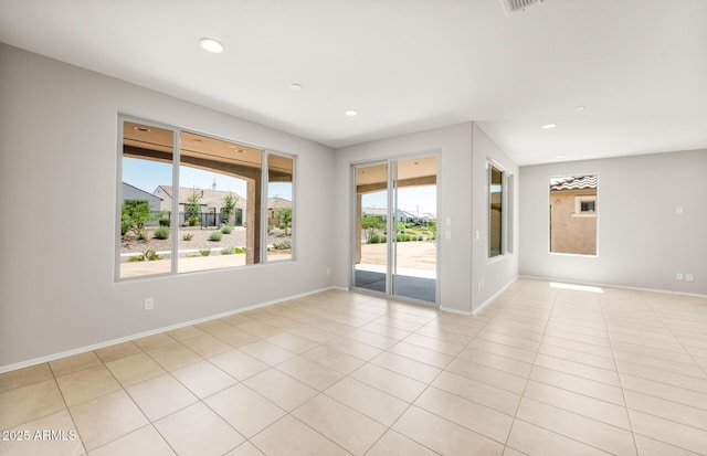 26949 W Lone Cactus Dr, Buckeye, AZ 85396 - empty room with recessed lighting, light tile patterned flooring, and baseboards
