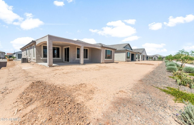 26949 W Lone Cactus Dr, Buckeye, AZ 85396 - rear view of house with central AC unit, stucco siding, and a patio area