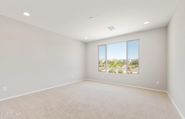 26949 W Lone Cactus Dr, Buckeye, AZ 85396 - spare room featuring light colored carpet, recessed lighting, and baseboards