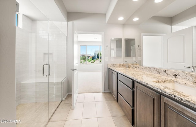 26949 W Lone Cactus Dr, Buckeye, AZ 85396 - bathroom with double vanity, tile patterned floors, recessed lighting, a stall shower, and plenty of natural light