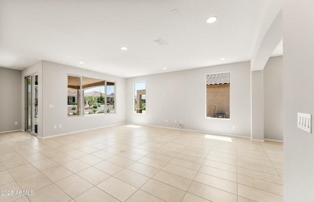 26949 W Lone Cactus Dr, Buckeye, AZ 85396 - empty room with recessed lighting, light tile patterned flooring, and baseboards