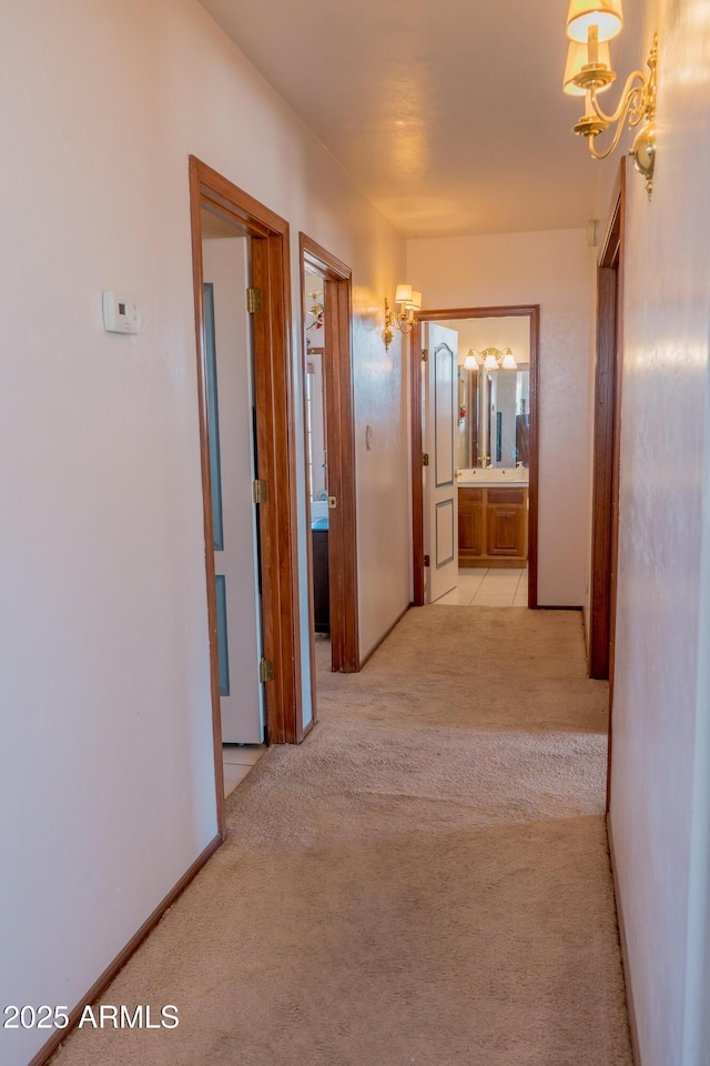 hall with light colored carpet