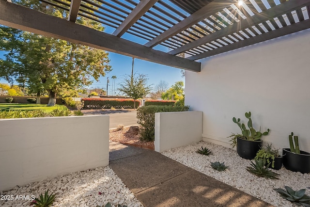 view of patio featuring a pergola