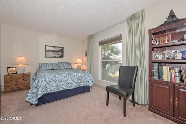 carpeted bedroom featuring a textured ceiling