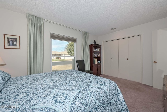 bedroom featuring a closet, carpet flooring, and a textured ceiling