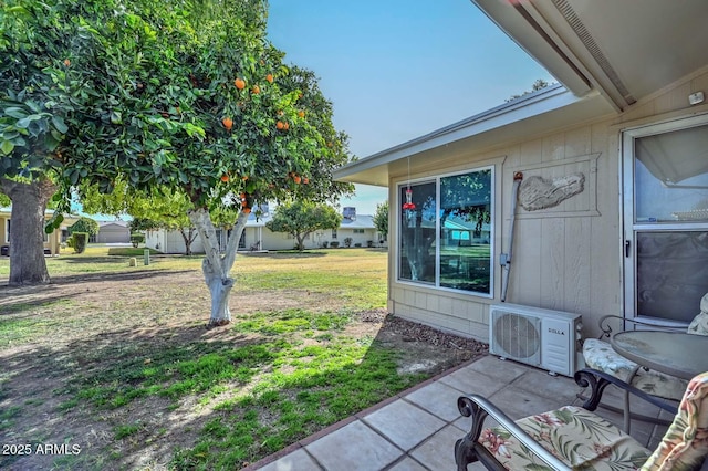 view of yard featuring a patio area and ac unit