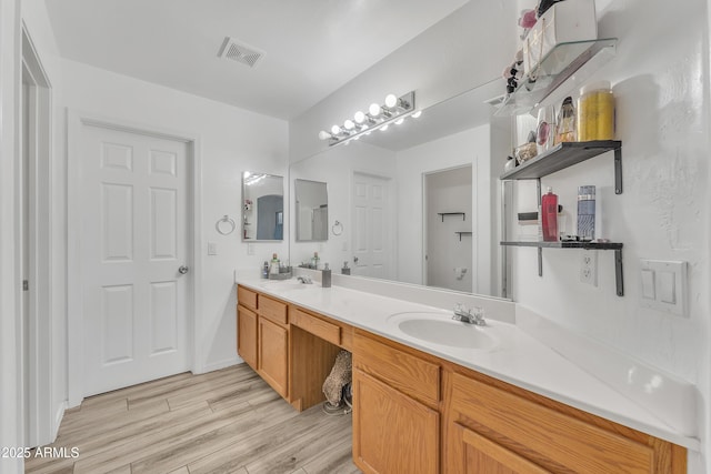 bathroom featuring vanity and hardwood / wood-style flooring