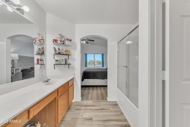 bathroom featuring wood-type flooring, vanity, and ceiling fan