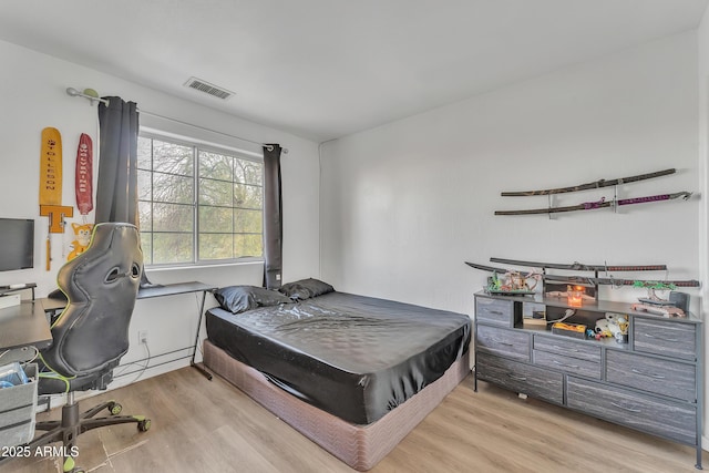 bedroom featuring light hardwood / wood-style floors