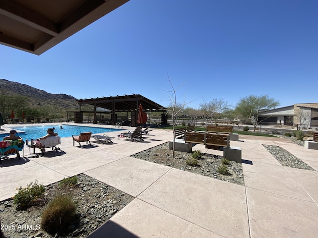 pool featuring a patio, a gazebo, and a mountain view