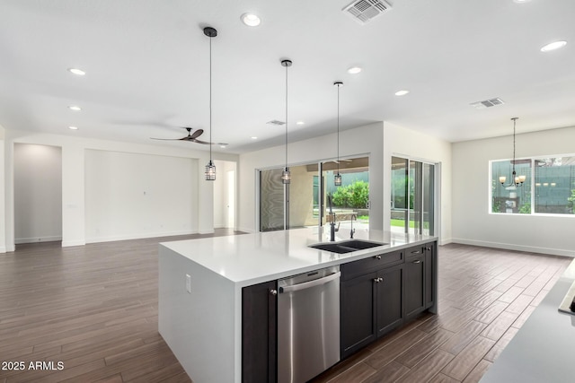 kitchen featuring open floor plan, visible vents, stainless steel dishwasher, and a sink