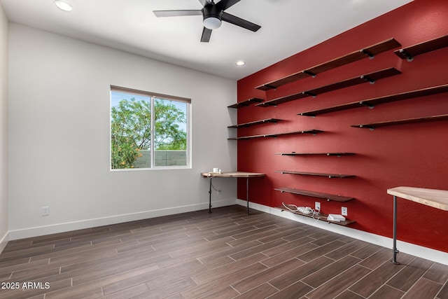 unfurnished room with recessed lighting, wood finished floors, a ceiling fan, and baseboards