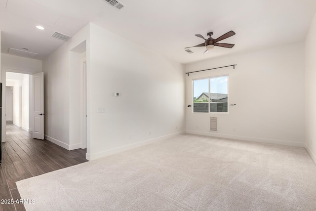 carpeted spare room with recessed lighting, visible vents, a ceiling fan, and baseboards