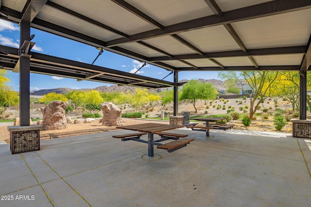 view of patio / terrace featuring a mountain view