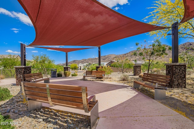 view of patio / terrace featuring central AC and a mountain view
