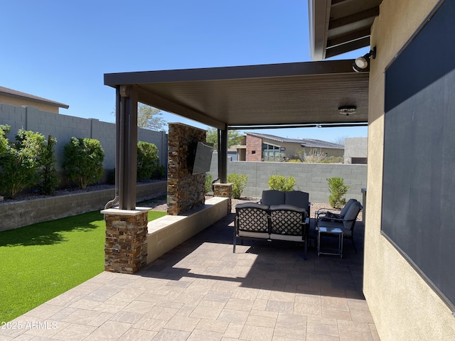 view of patio / terrace featuring a fenced backyard and an outdoor living space