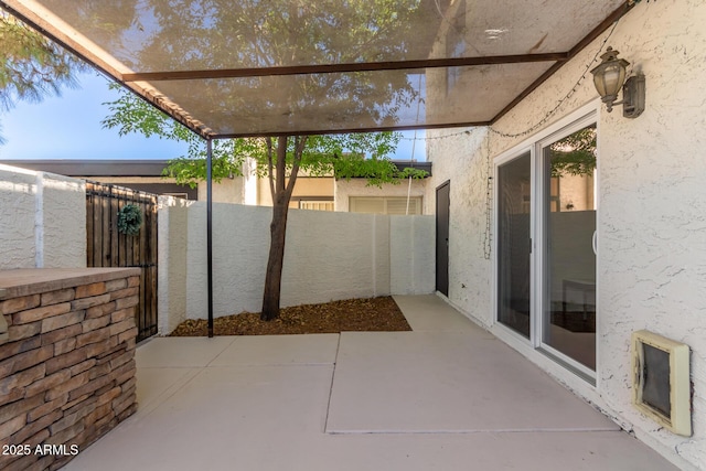 view of patio / terrace featuring fence