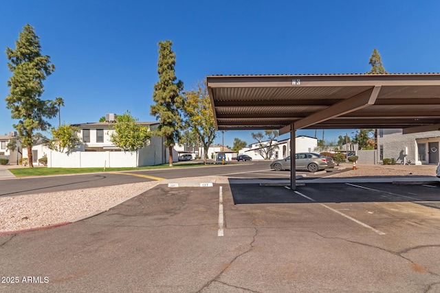 partially covered parking lot with a residential view