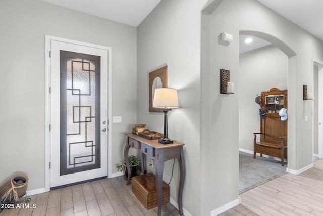 entryway with light hardwood / wood-style floors