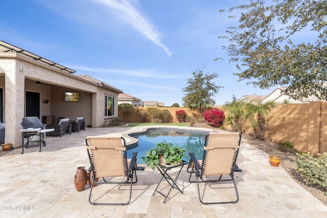 view of swimming pool with a patio