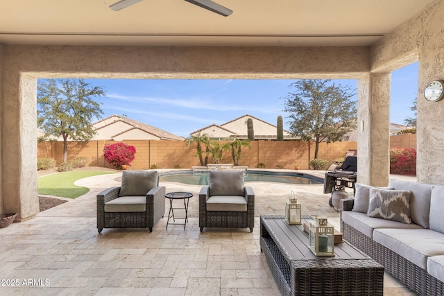 view of patio featuring an outdoor living space, a fenced in pool, and ceiling fan