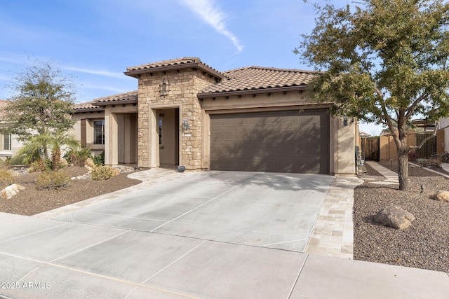 mediterranean / spanish-style home with a garage