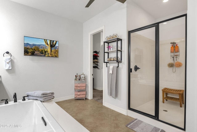 bathroom with a freestanding tub, baseboards, ceiling fan, recessed lighting, and a stall shower