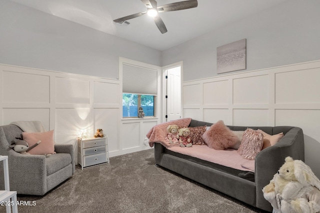 interior space featuring visible vents, wainscoting, and a decorative wall