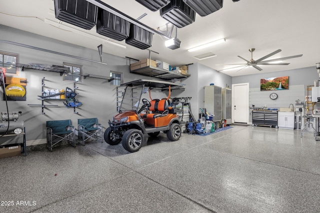 garage featuring ceiling fan and a garage door opener